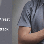 Person holding their chest because of pain, which could be a sign of a heart problem - highlighting the need to understand the difference between cardiac arrest vs heart attack.