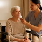 Caregiver assisting a patient with respiratory therapy at home, showing safety and comfort during seasonal changes.
